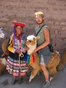 Kevin mounting an alpaca outside Cusco, Peru