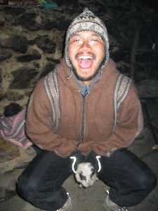 Kevin mounting a guinea pig on the inca trail, Peru